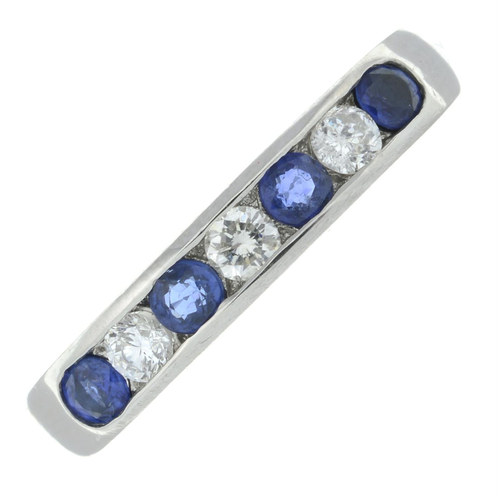 A platinum sapphire and brilliant-cut diamond half eternity ring.