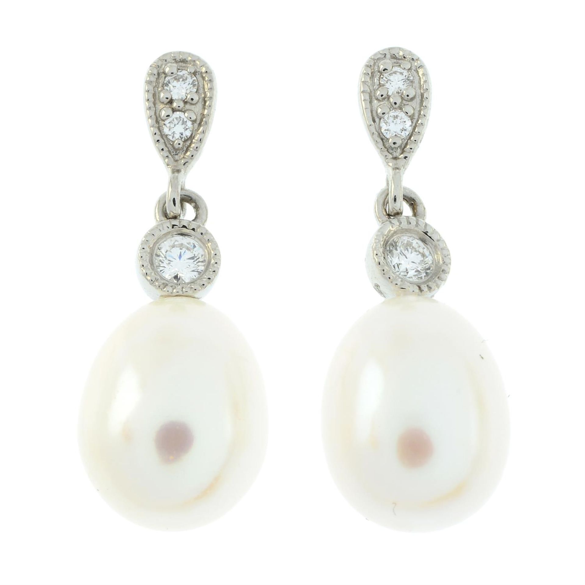 A pair of brilliant-cut diamond and cultured pearl drop earrings.