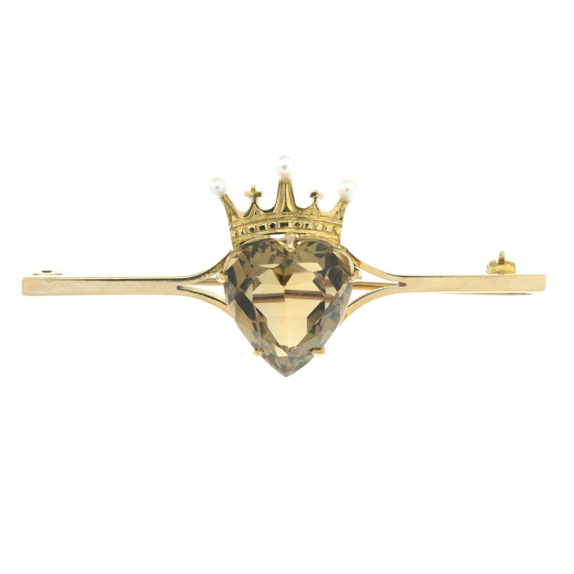 An early 20th century 9ct gold smoky quartz and seed pearl heart and crown bar brooch.