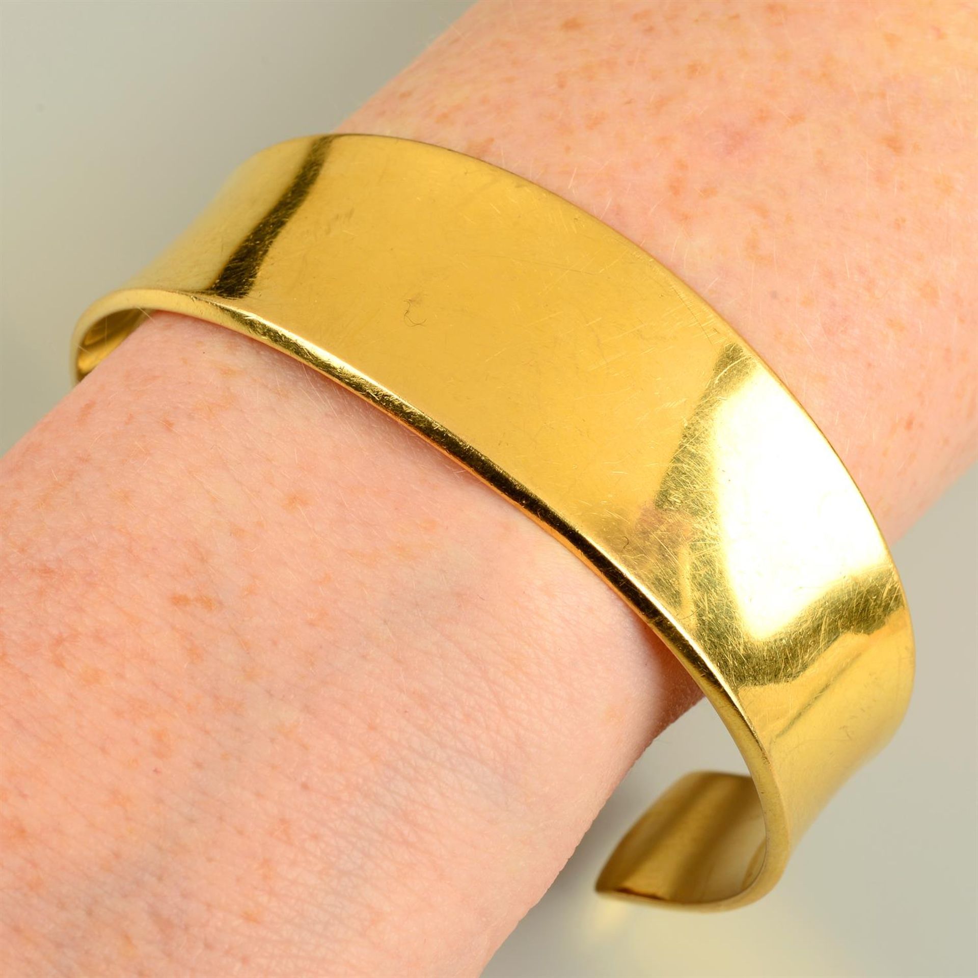 A 1970s 18ct gold flared bangle, by Georg Jensen, with later engraved bunny. - Image 5 of 5