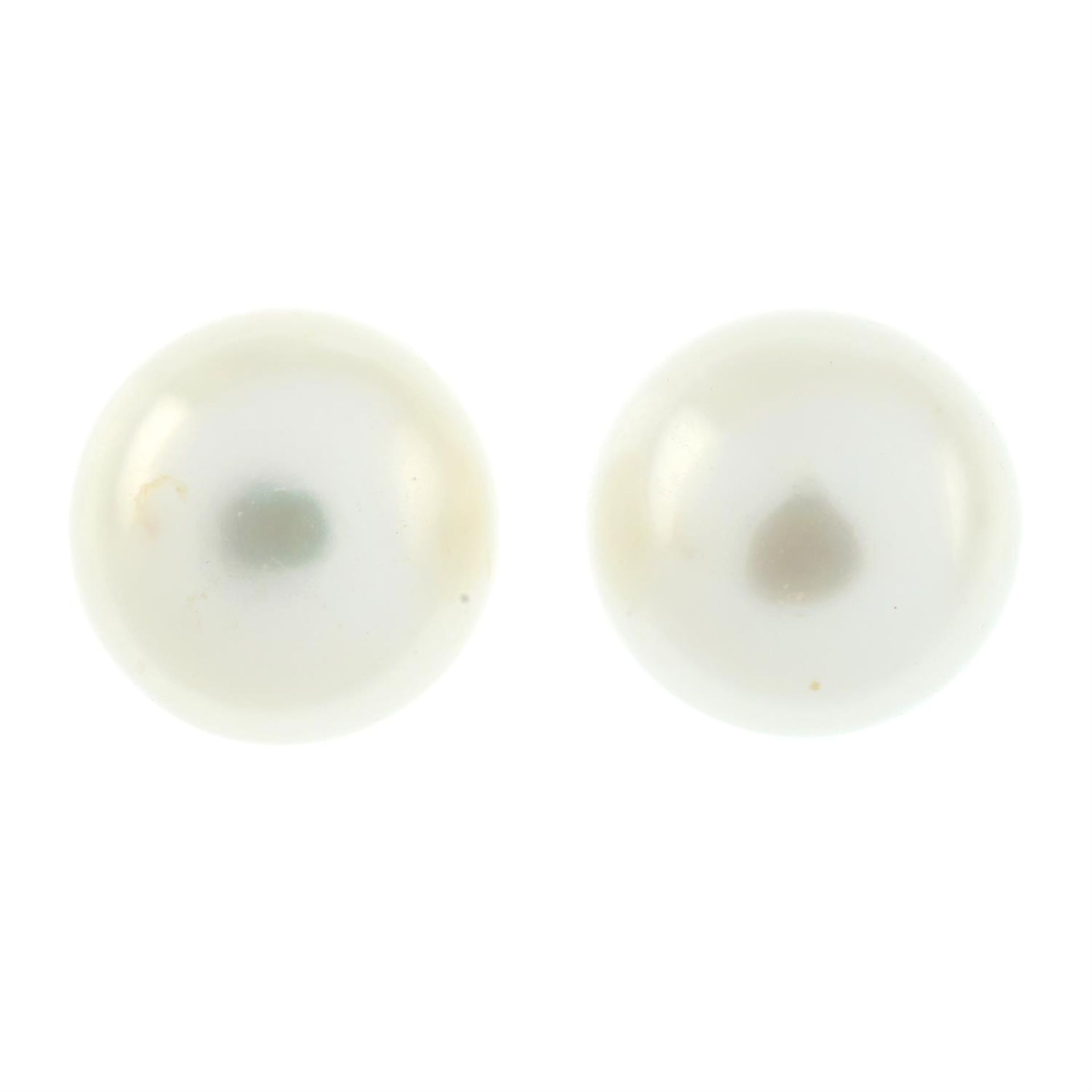 A pair of cultured mebe pearl stud earrings.