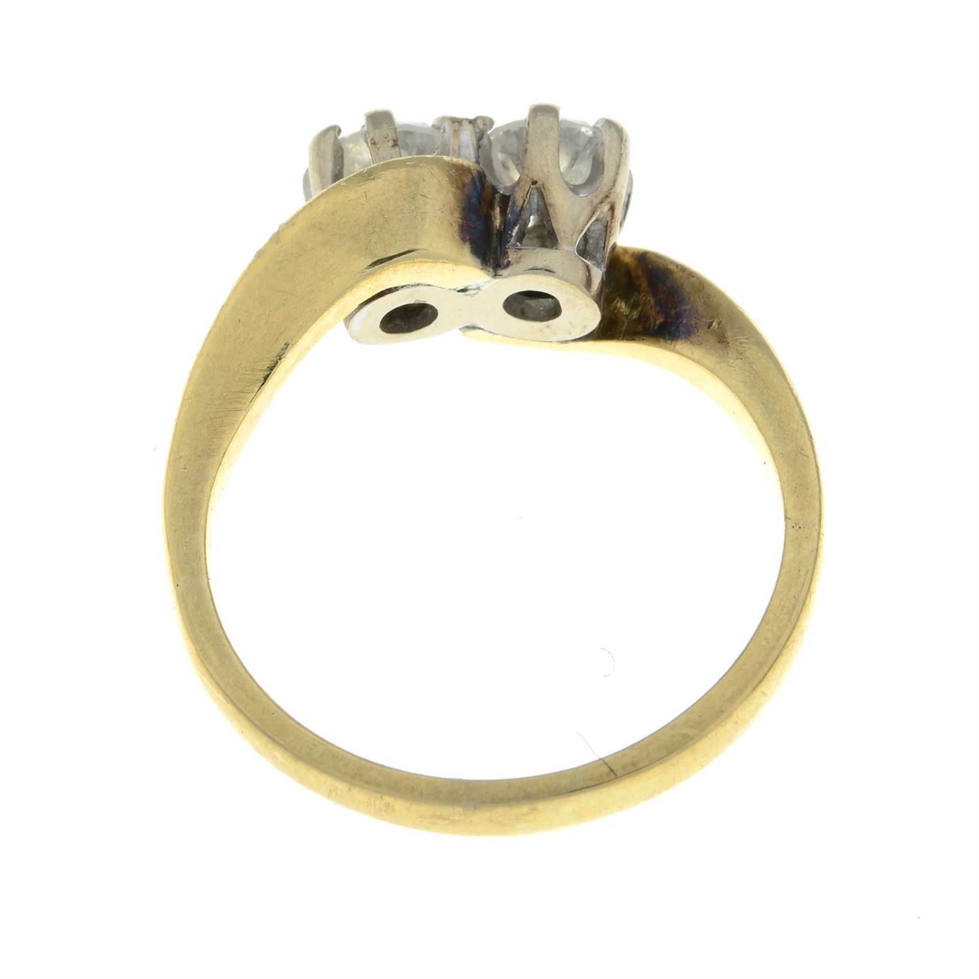 An 18ct gold brilliant-cut diamond two-stone crossover ring. - Image 2 of 2