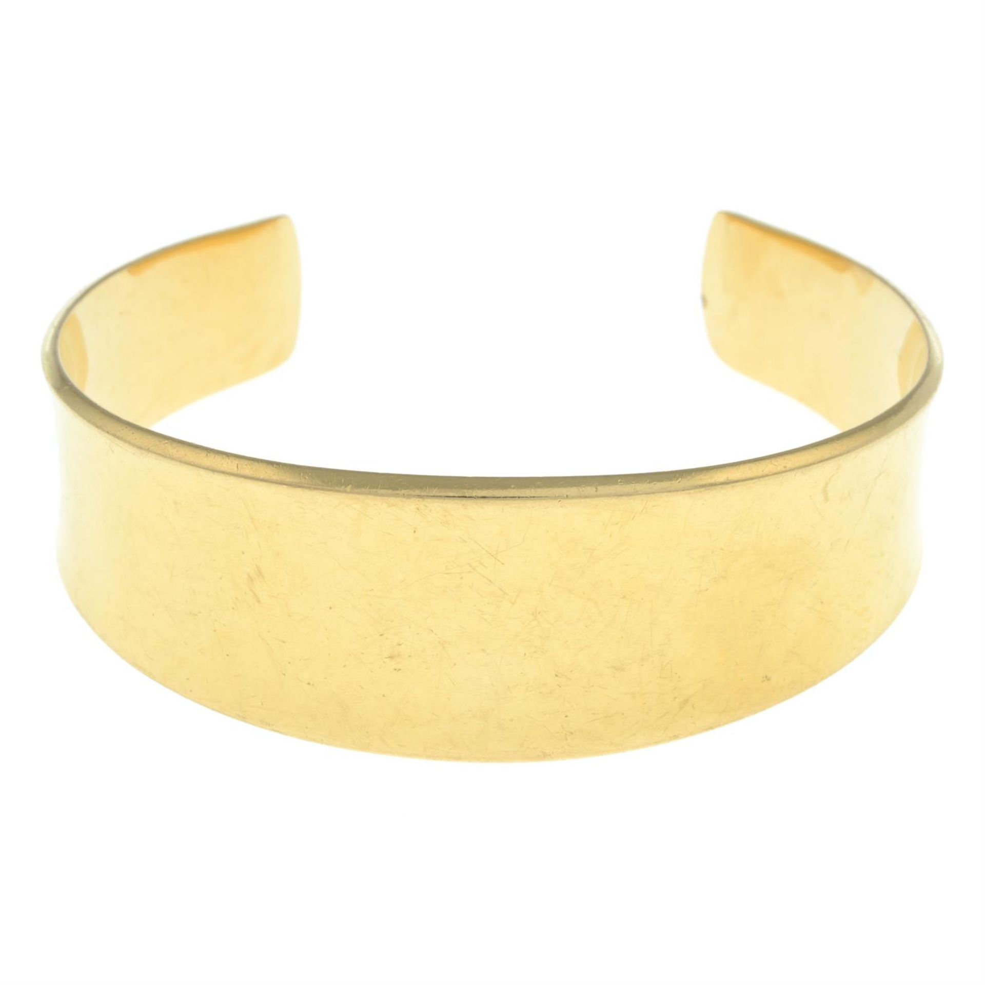 A 1970s 18ct gold flared bangle, by Georg Jensen, with later engraved bunny.