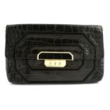 ANYA HINDMARCH - an imitation crocodile black leather clutch.