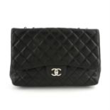 CHANEL - a black Caviar leather Jumbo single flap bag.