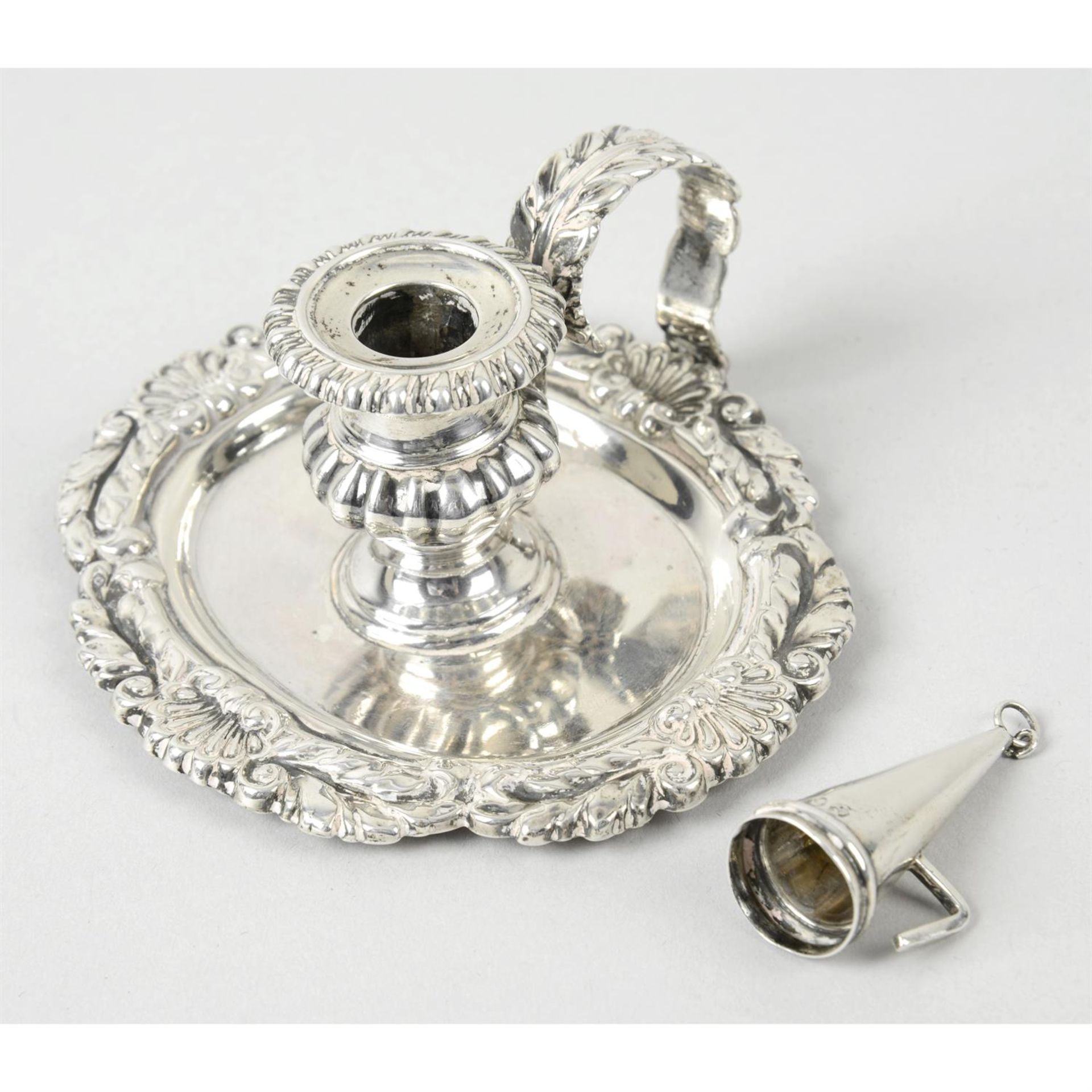 A late George III silver small chamberstick and snuffer.