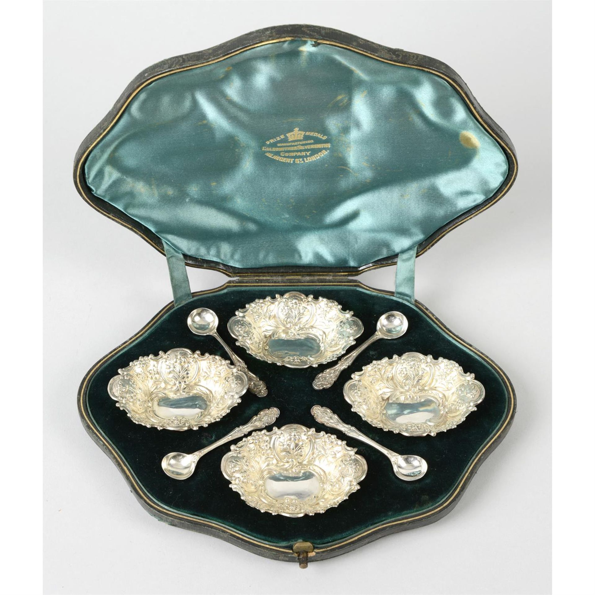 A cased set of late Victorian silver open salts with spoons; together with a further set of four