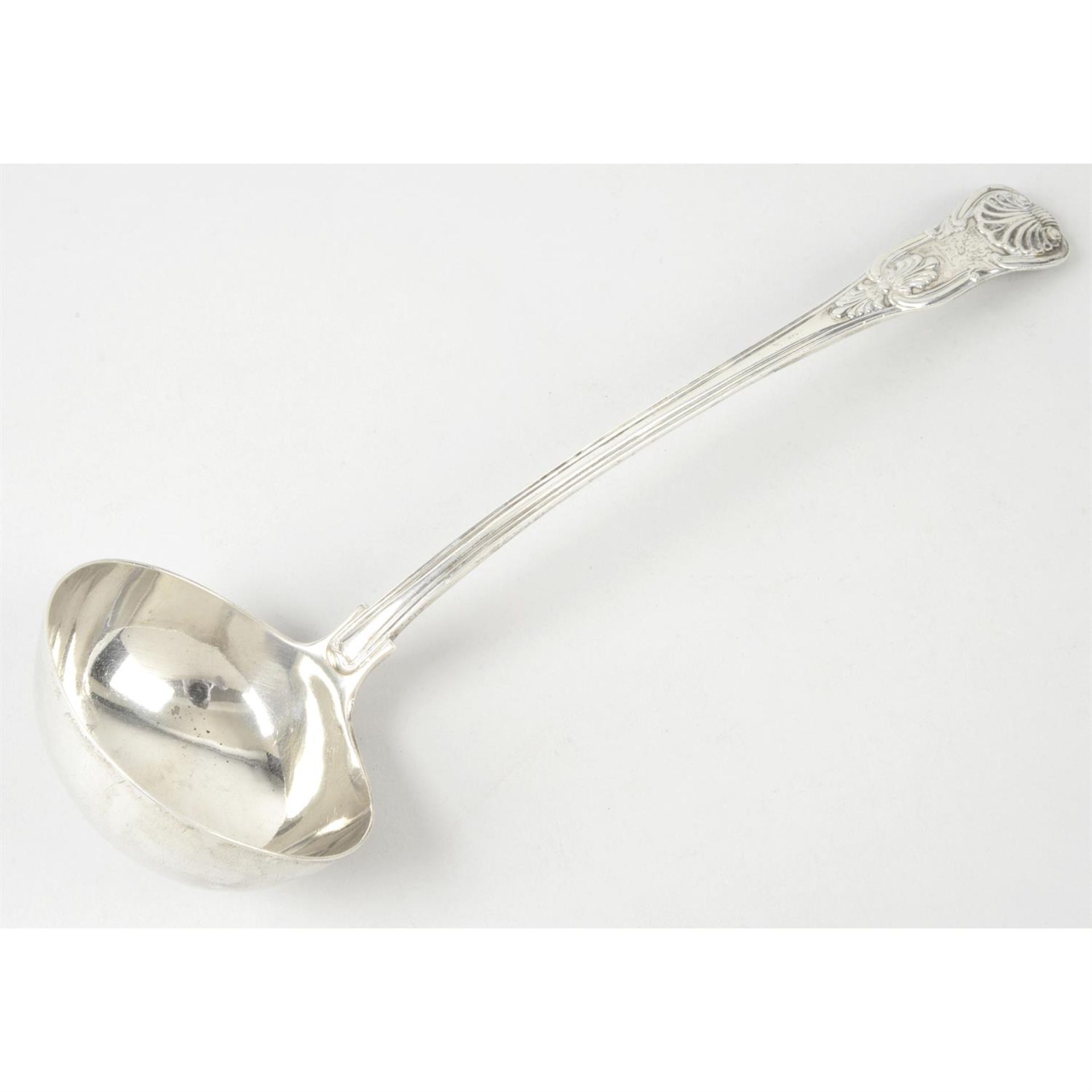 A mid-Victorian silver soup ladle in King's pattern.