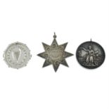 Three assorted silver prize medals. (3).