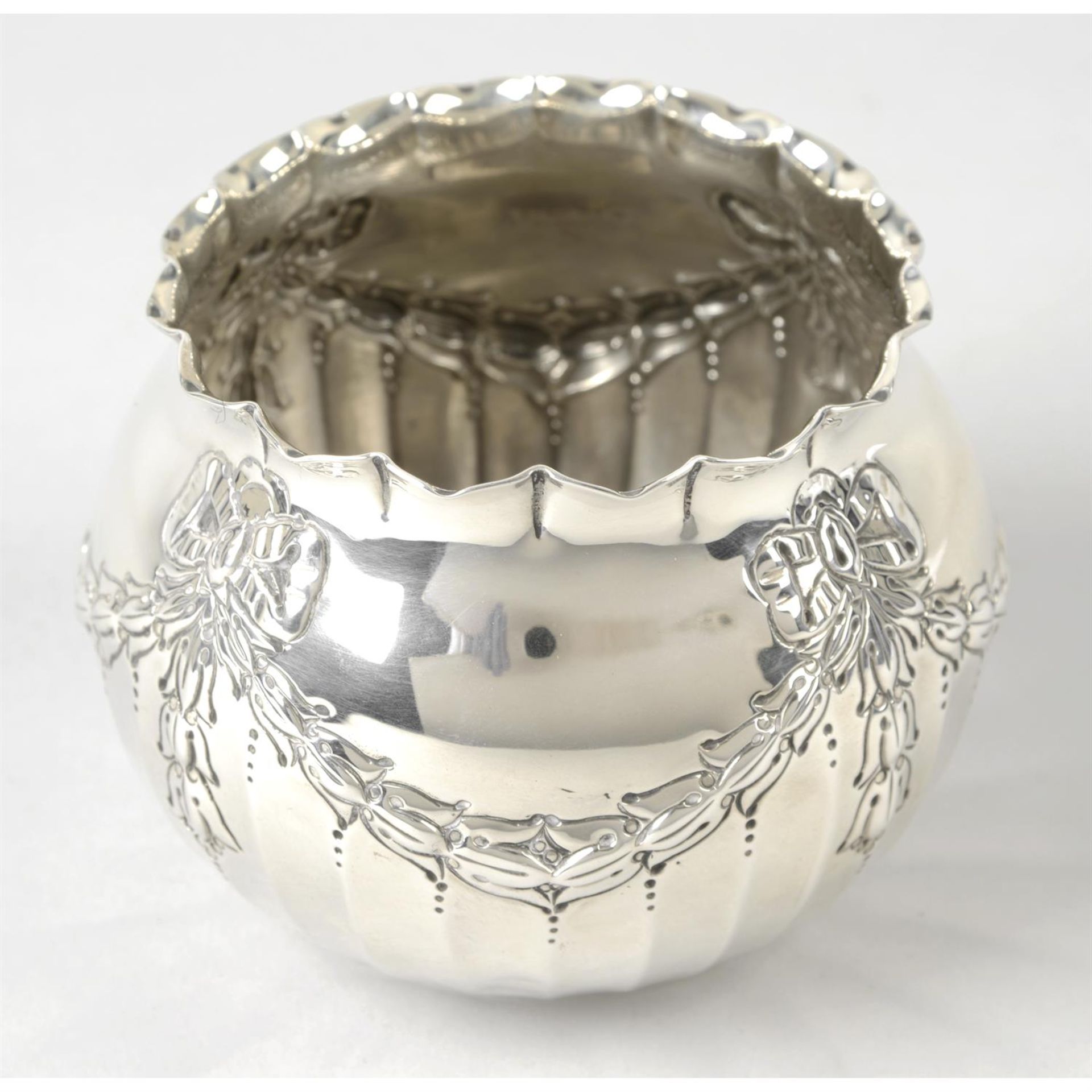 A turn of the century silver bowl with swag decoration.