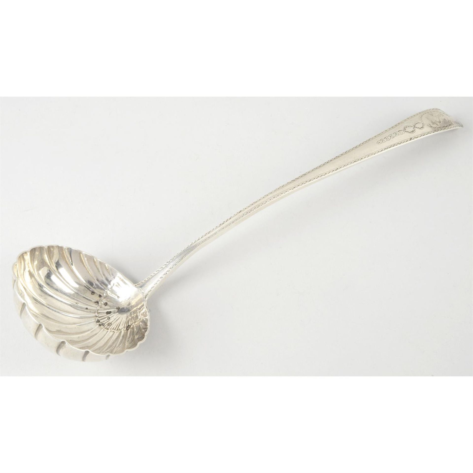 A George III Irish silver soup ladle with shell bowl.