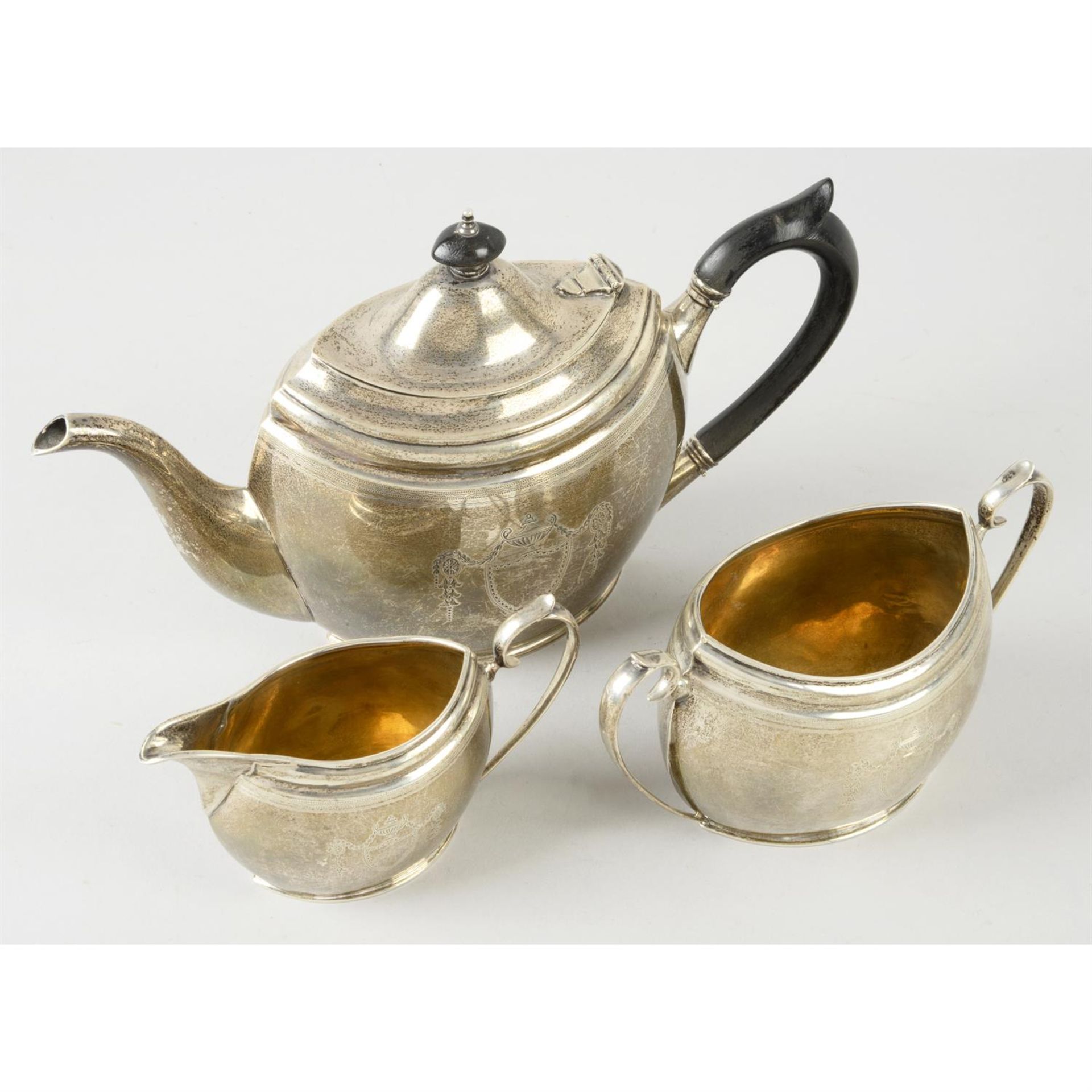 A George V silver three piece tea service.