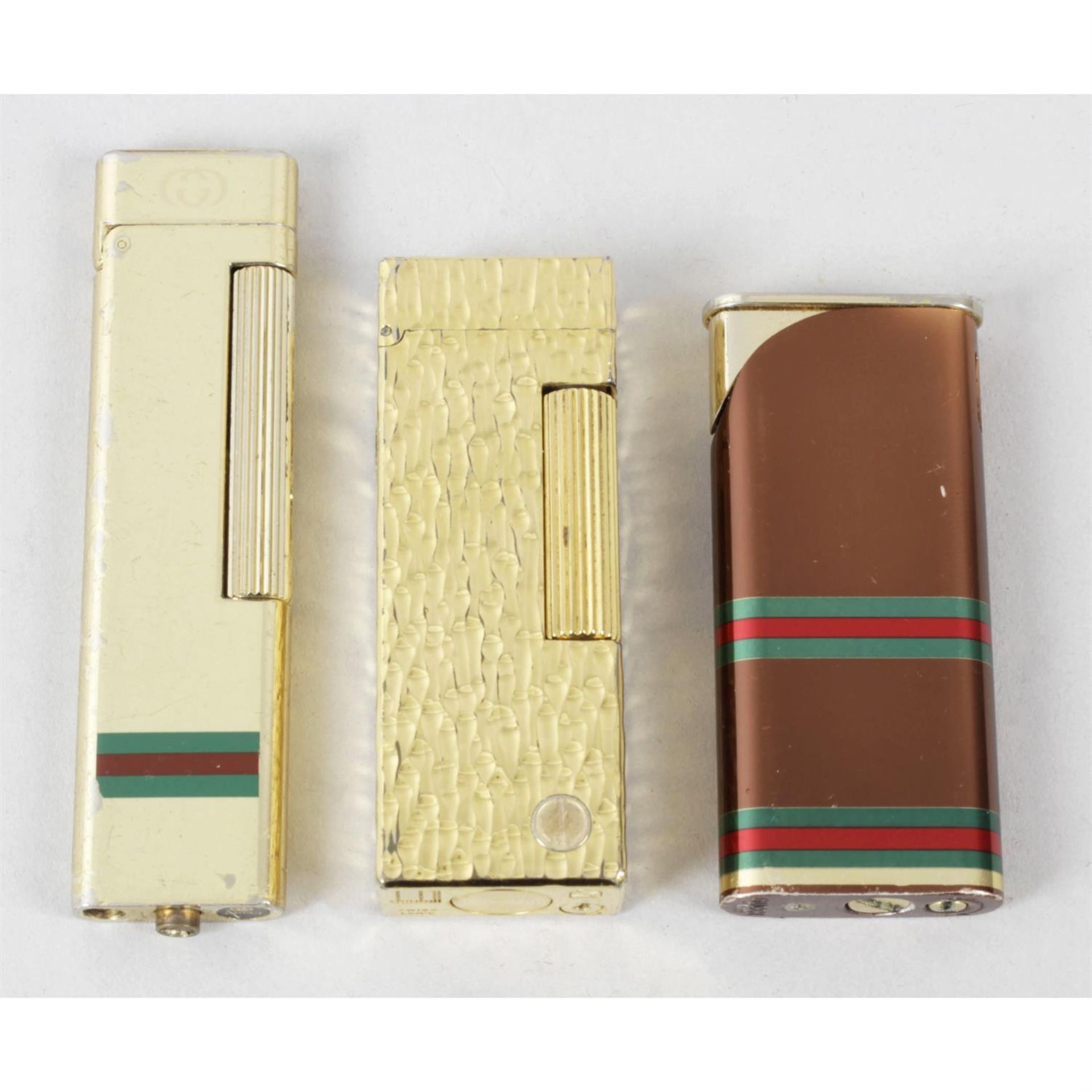 A mixed selection of assorted lighters, to include Gucci and Dunhill examples.