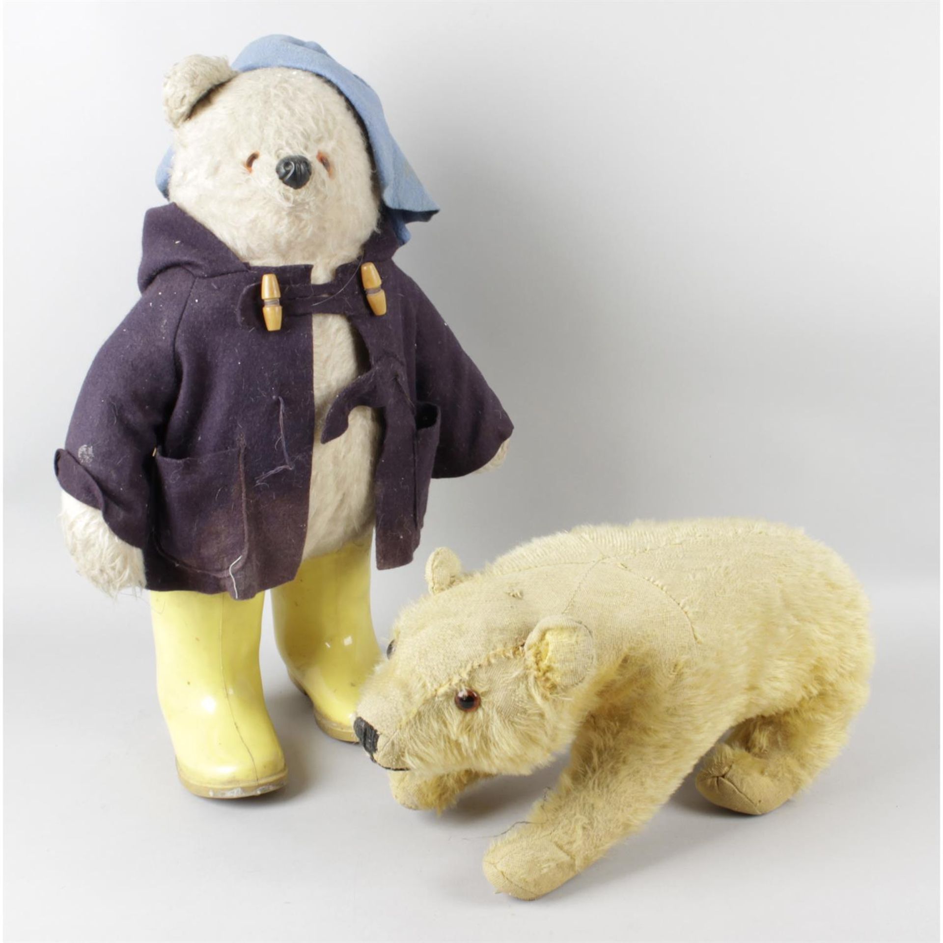 A Gabrielle Designs Paddington Bear soft toy, together with a Chiltern Toys gold plush bear.