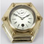 A reproduction brass cased desk clock.