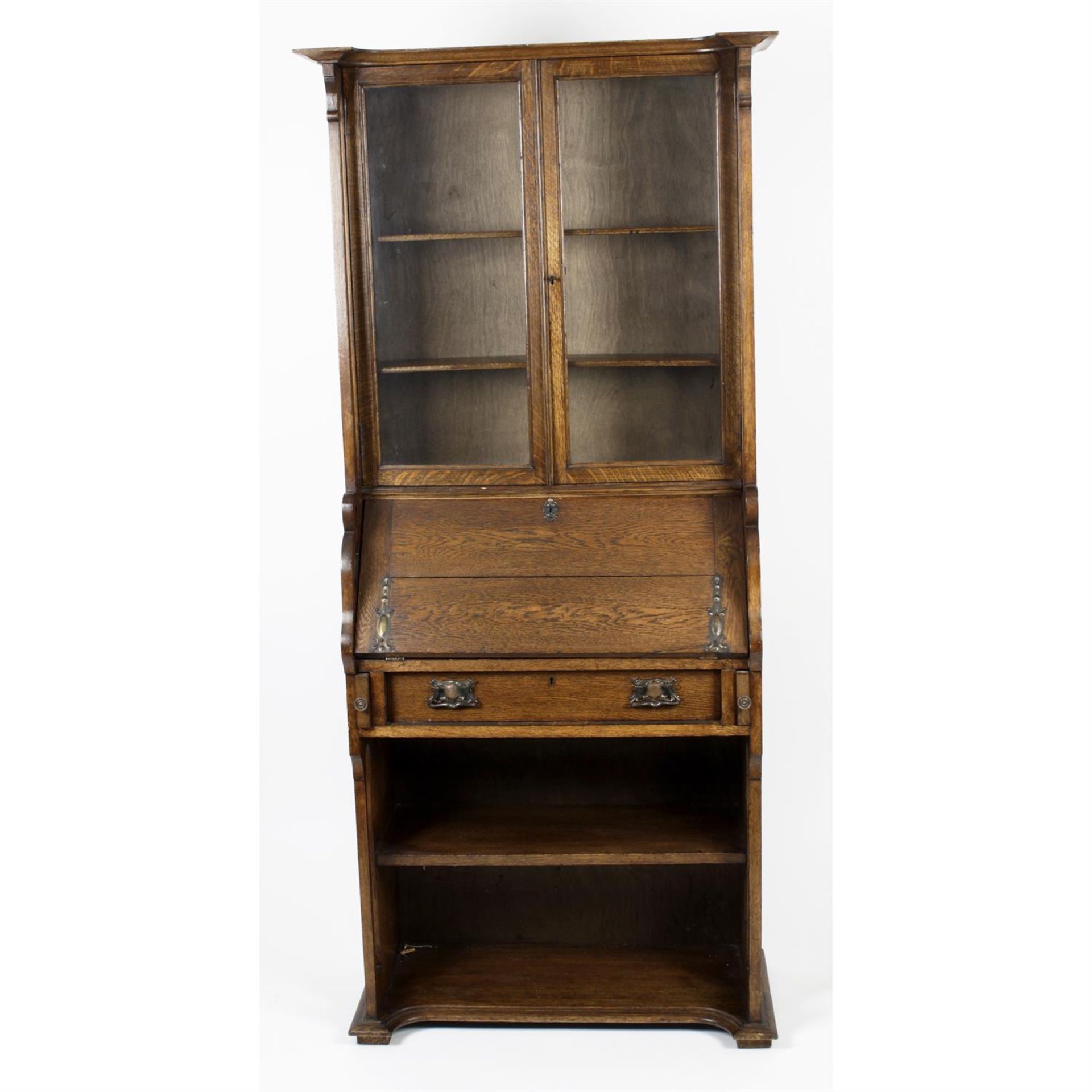 An early 20th century oak arts and crafts style bureau bookcase.