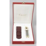 A Cartier 'Twist Action' propelling ball point pen, together with a matching propelling pencil and