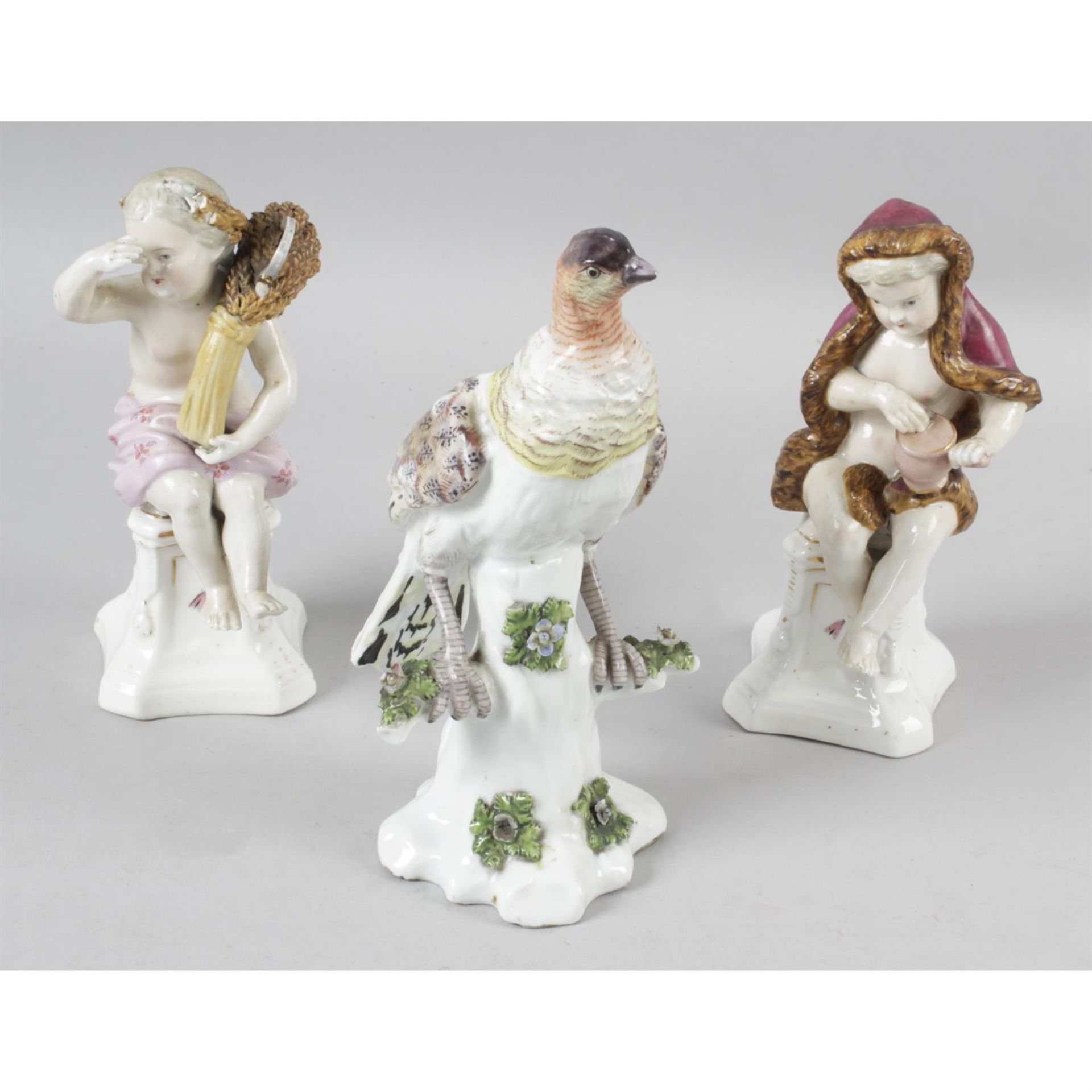 A 19th century porcelain figure, together with a pair of 19th century continental porcelain figures.