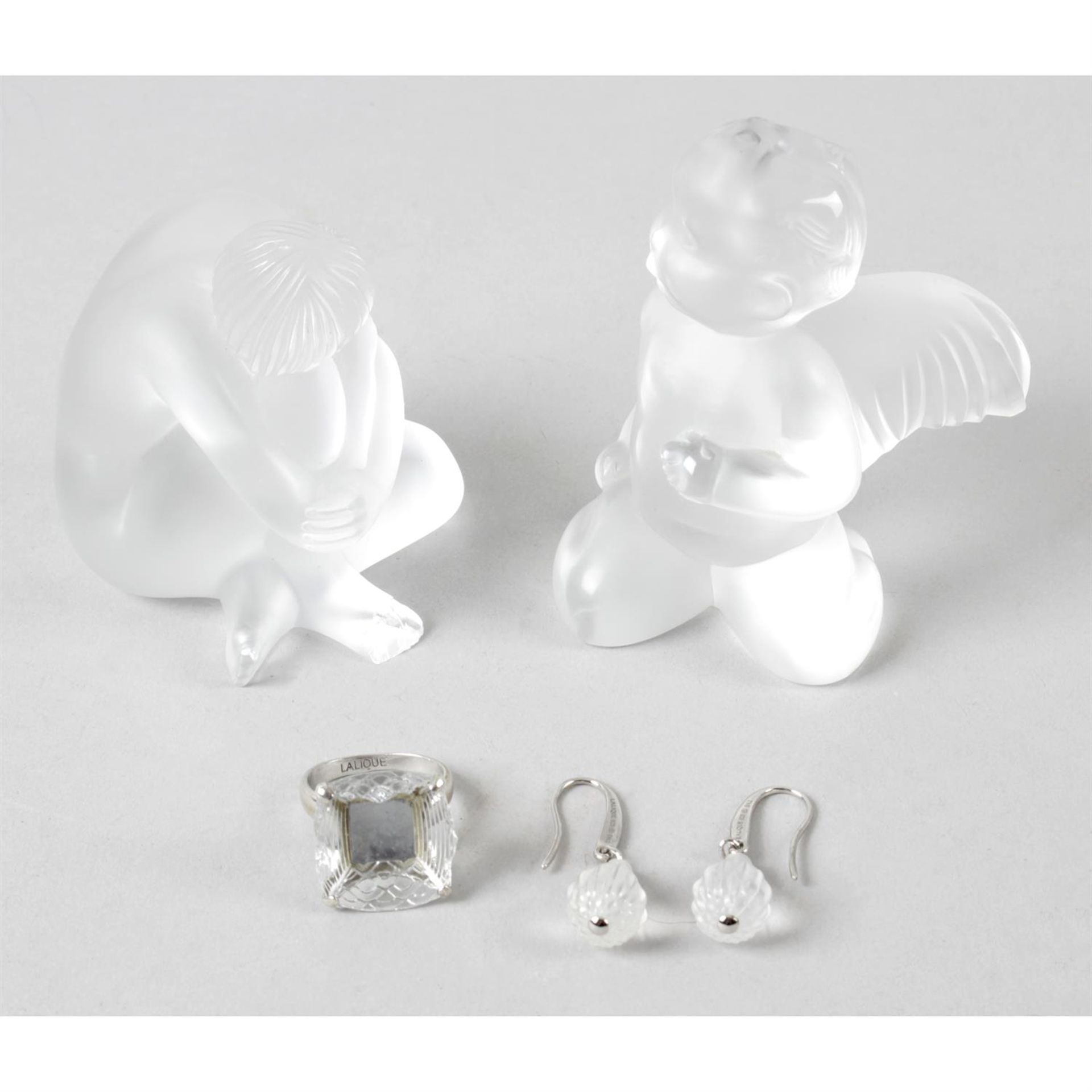 A Lalique frosted glass cherub and seated figure, together with a ring and earrings.