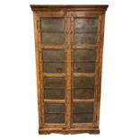 An unusual stained wooden storage cupboard.
