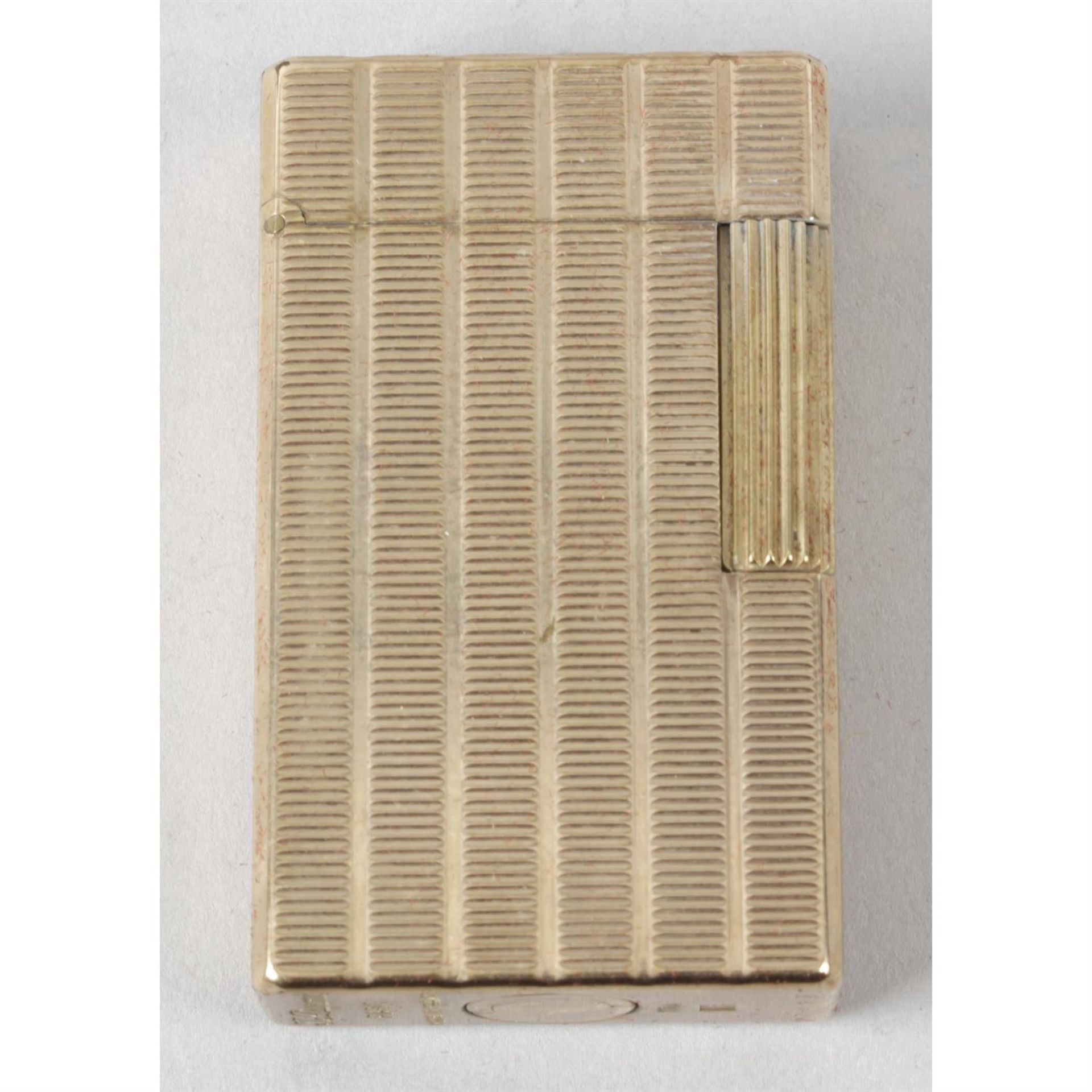 A Dupont cigarette lighter.