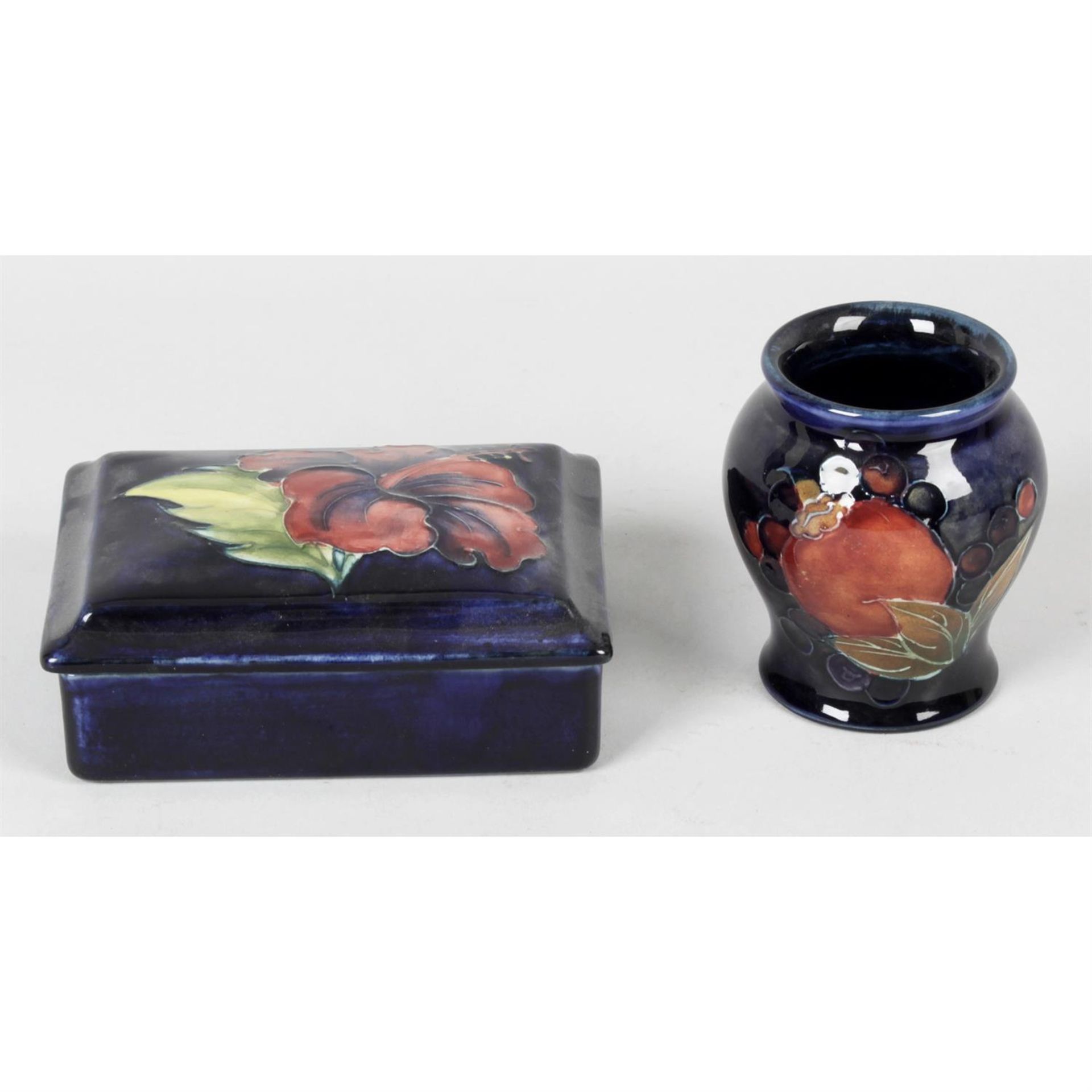 A Moorcroft Pottery trinket box and cover, together with a similar vase.