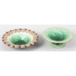 A Limoges green enamelled pedestal dish, together with a similar dish. (2)