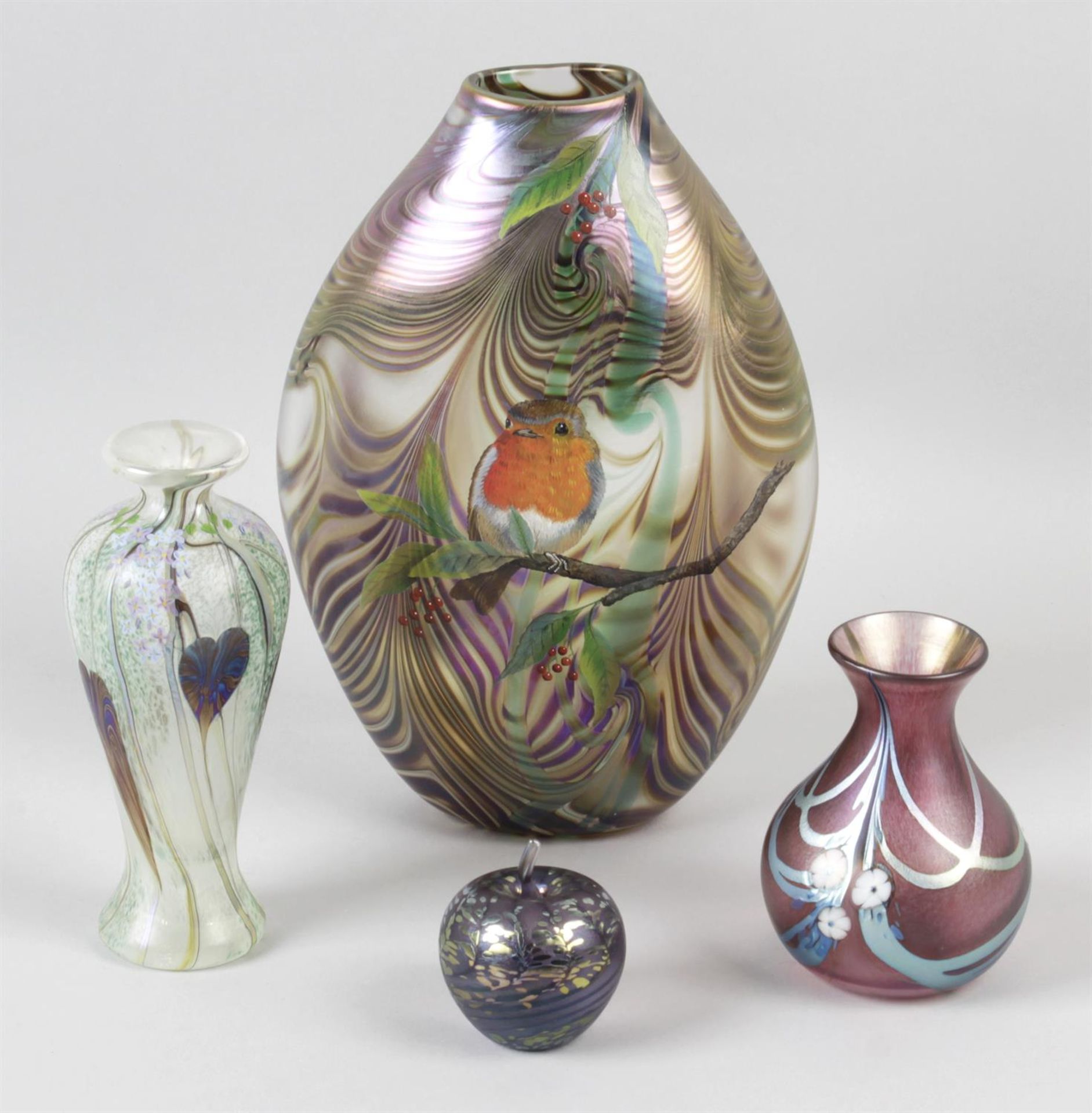 A selection of iridescent glass items, to include a vase with hand painted decoration, okra vases,