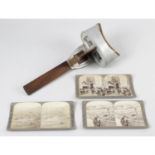 A handheld stained wooden and metal stereoscopic picture card viewer, together with a selection of