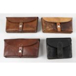 Three Swiss Army brown leather military ammunition belt pouches, together with another black