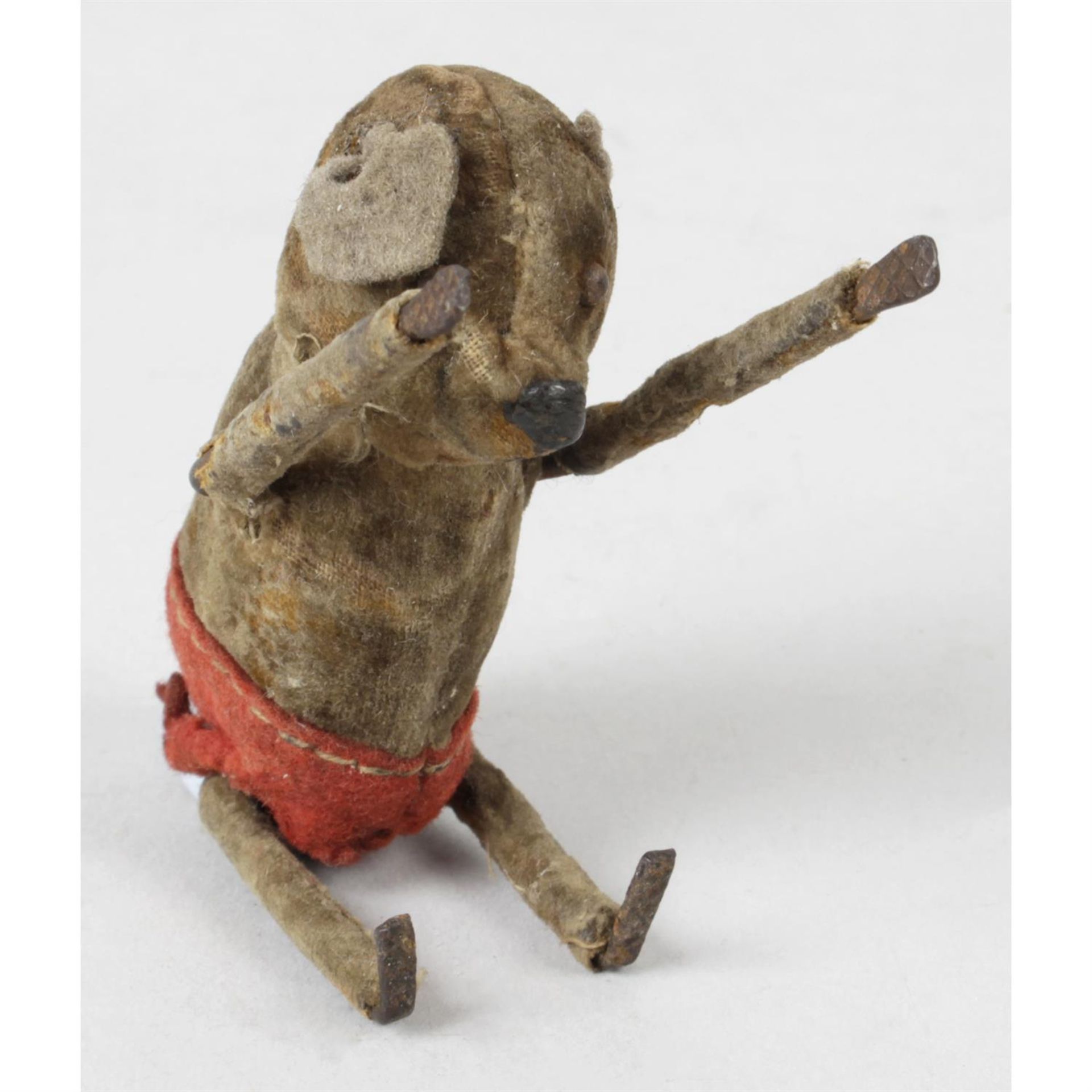 An early 20th century clockwork novelty toy, modelled as a gamboling mouse.