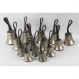 A collection of fourteen Victorian campanology hand bells by J. Shaw and Co. Bradford.