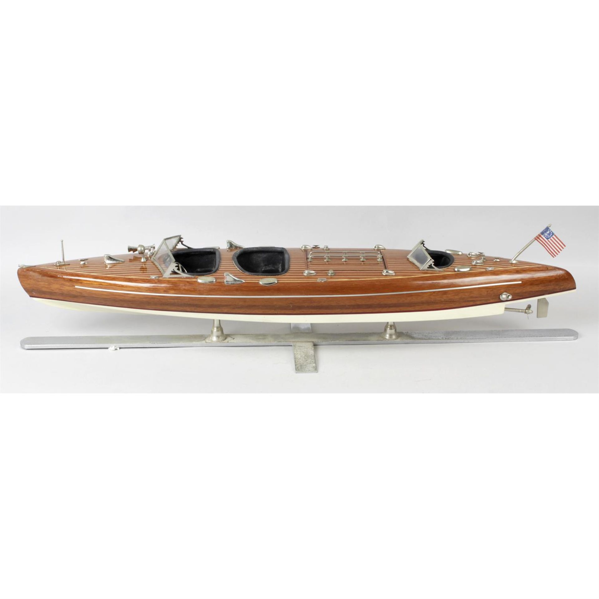 A wooden Chris Craft Typhoon model boat.