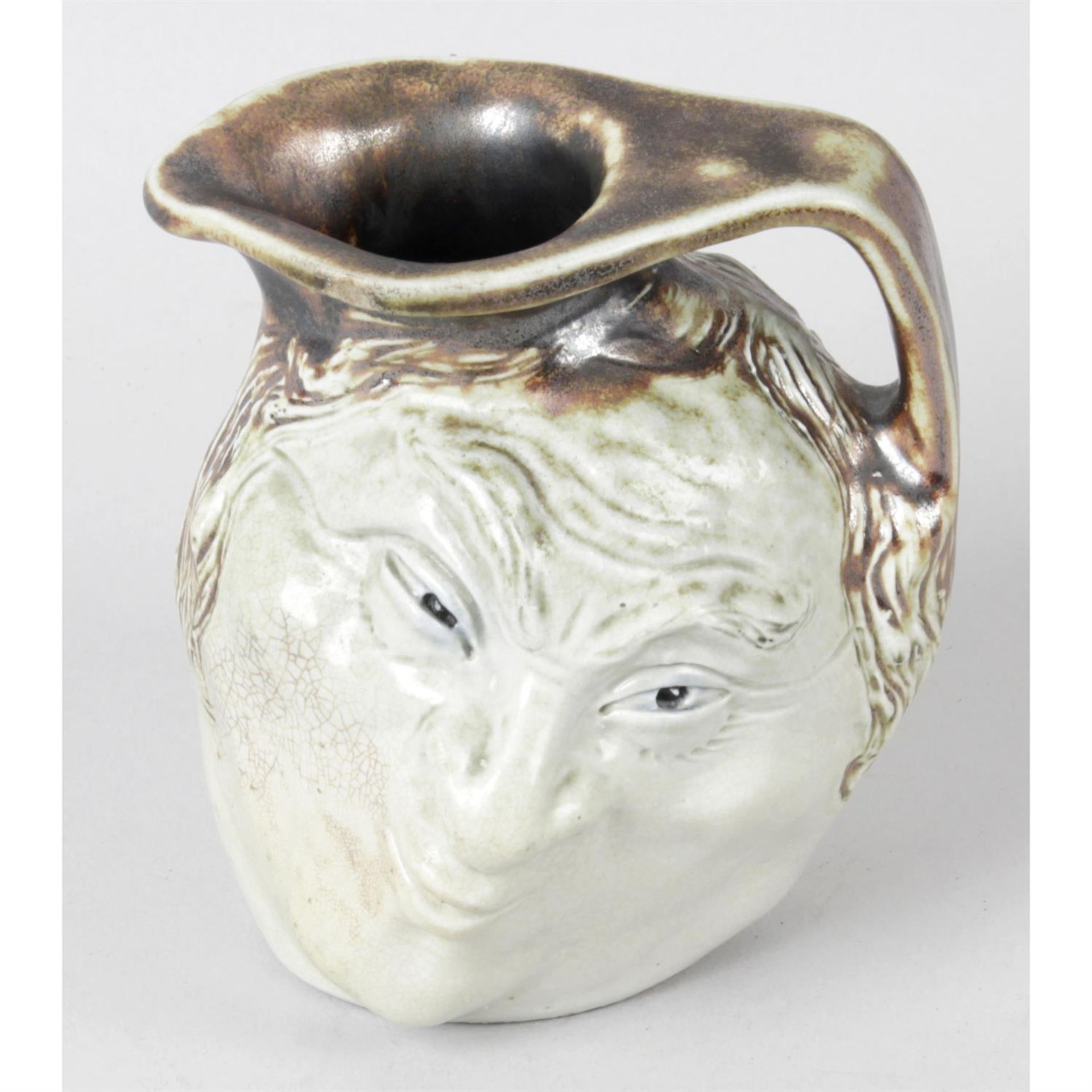 A Martin Brothers pottery 'face mask' jug. - Image 2 of 3
