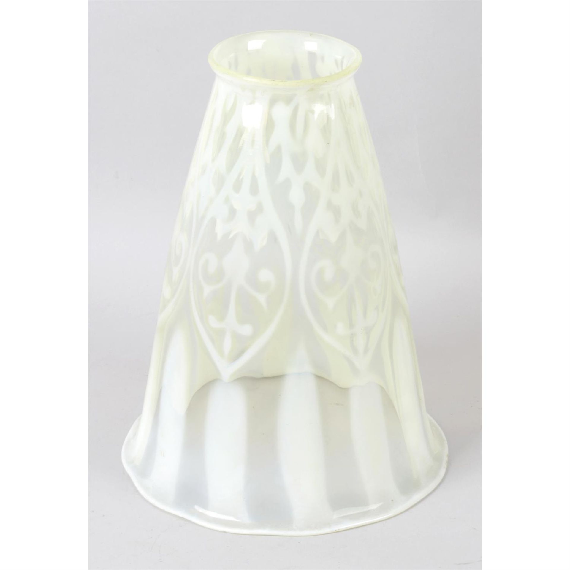 An Art Nouveau green Vaseline glass lamp shade.