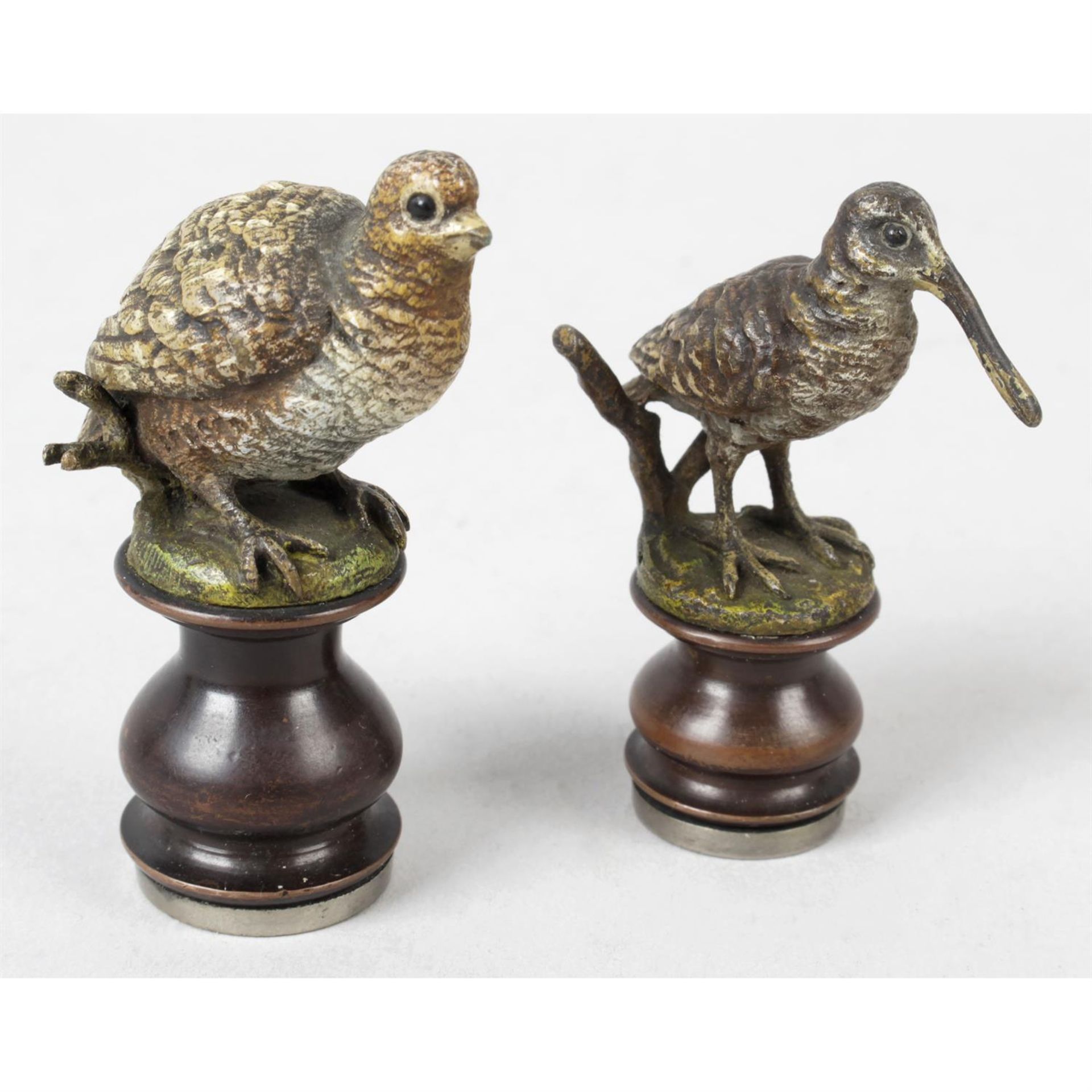 A small bronze cold painted desk seal modelled as a game bird, together with another similar