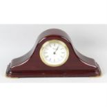 A modern stained wooden cased wall clock, together with other examples. (4)