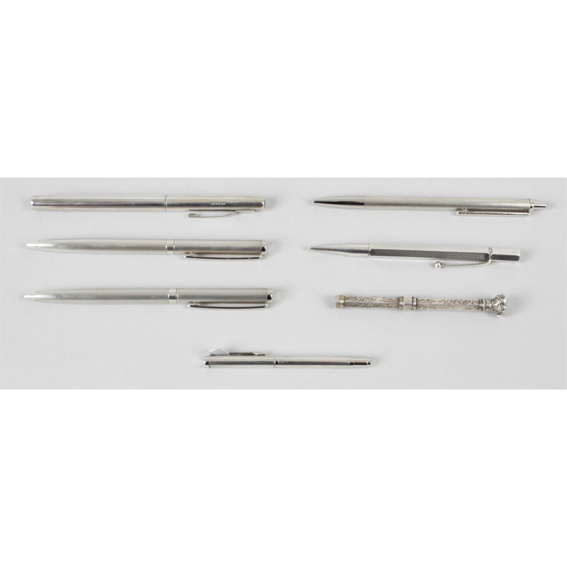 A selection of seven assorted silver cased pens.