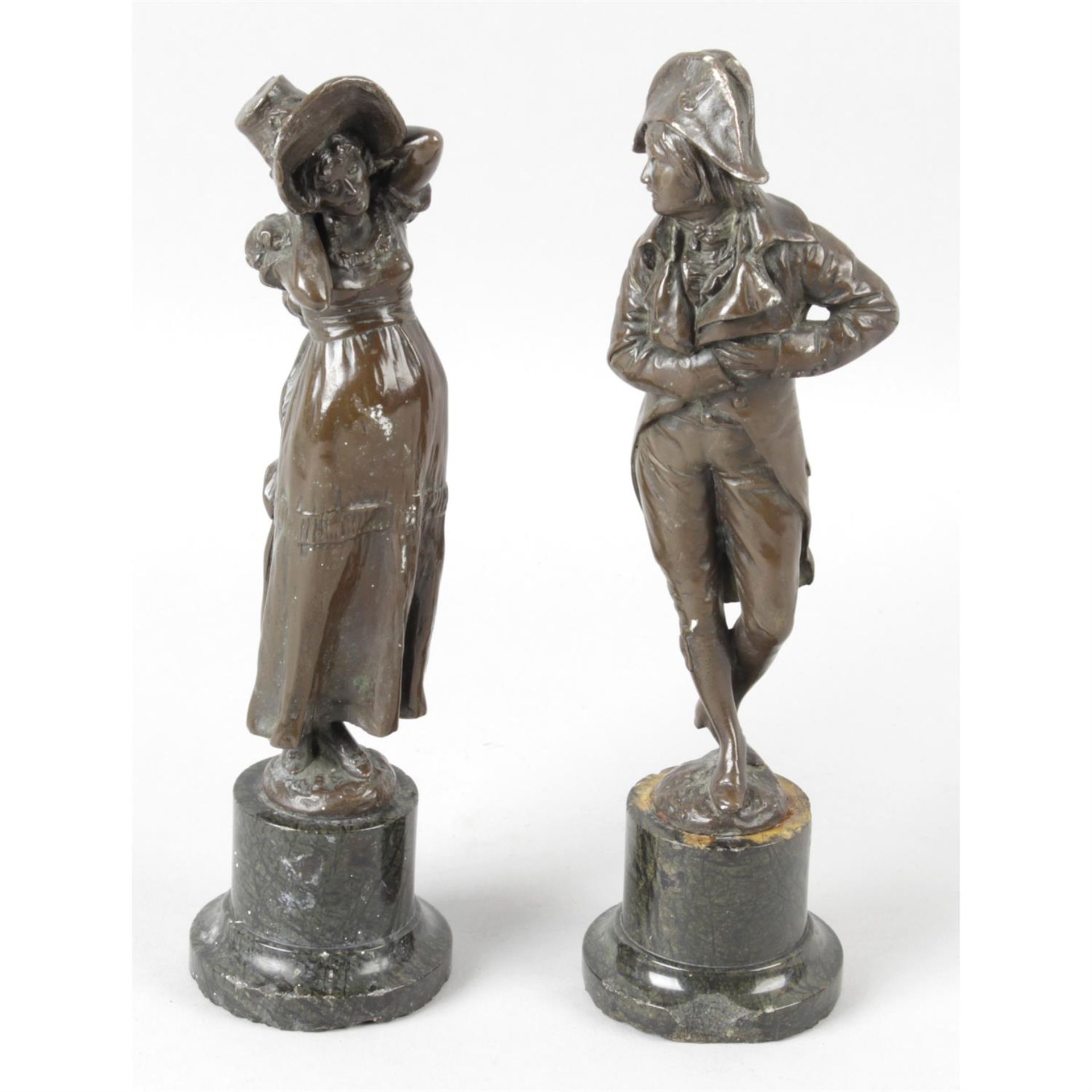 Two bronze figures.