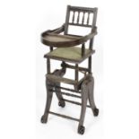 An early 20th century stained wooden metamorphic child's highchair and rocking chair.