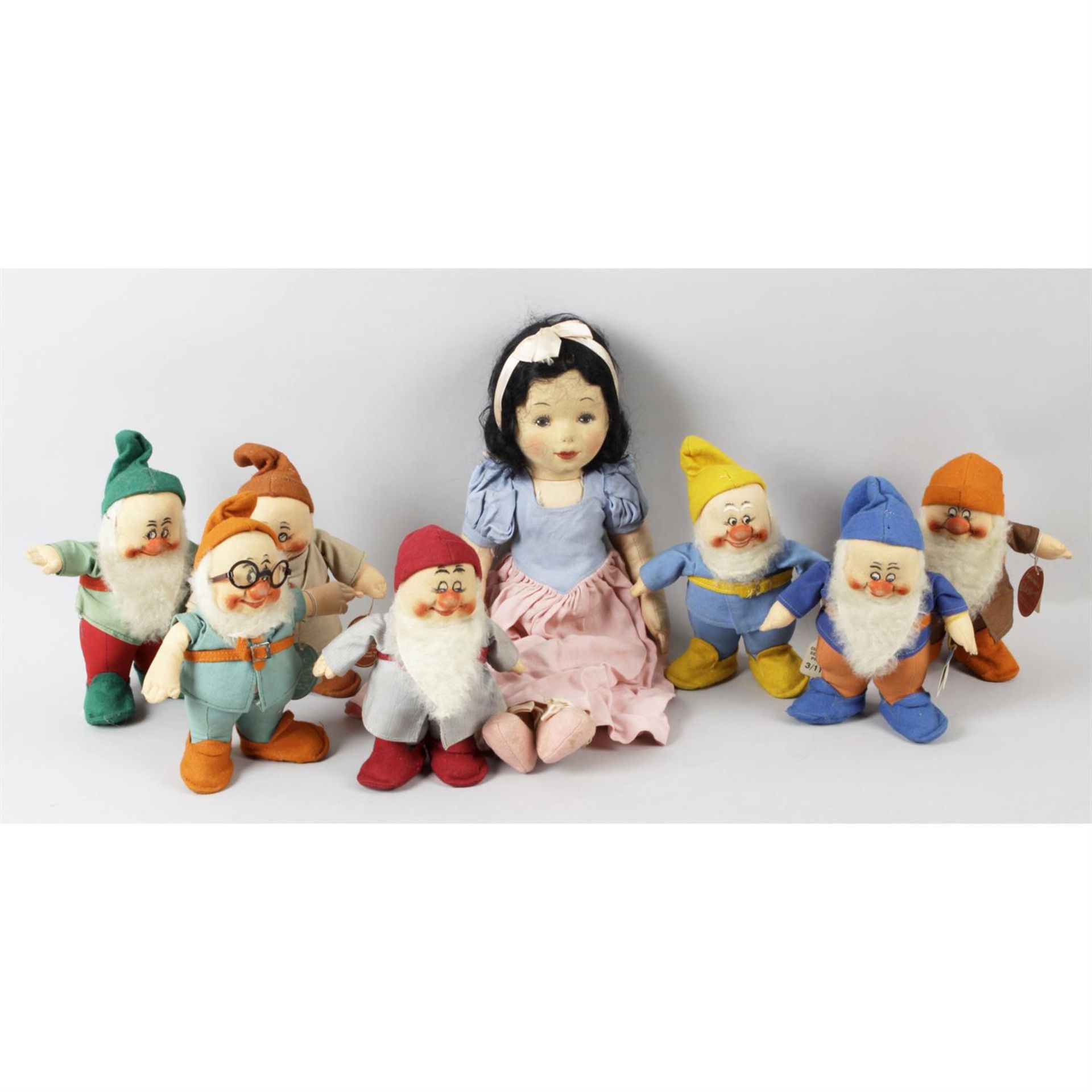 A Chad Valley doll modelled as Snow White, together with a set of seven dwarfs.