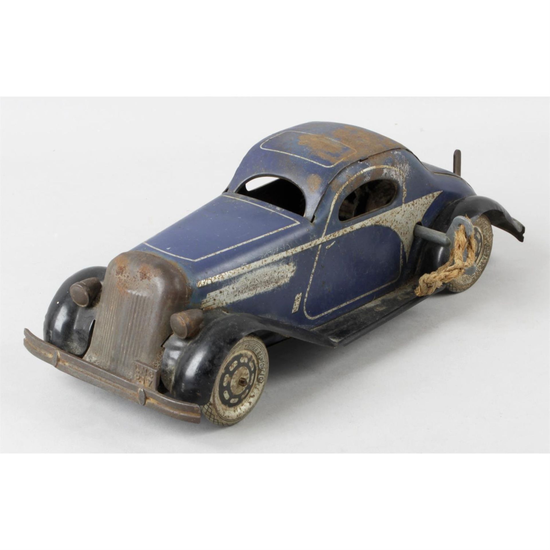 A Louis Marx tinplate model two door coupe.