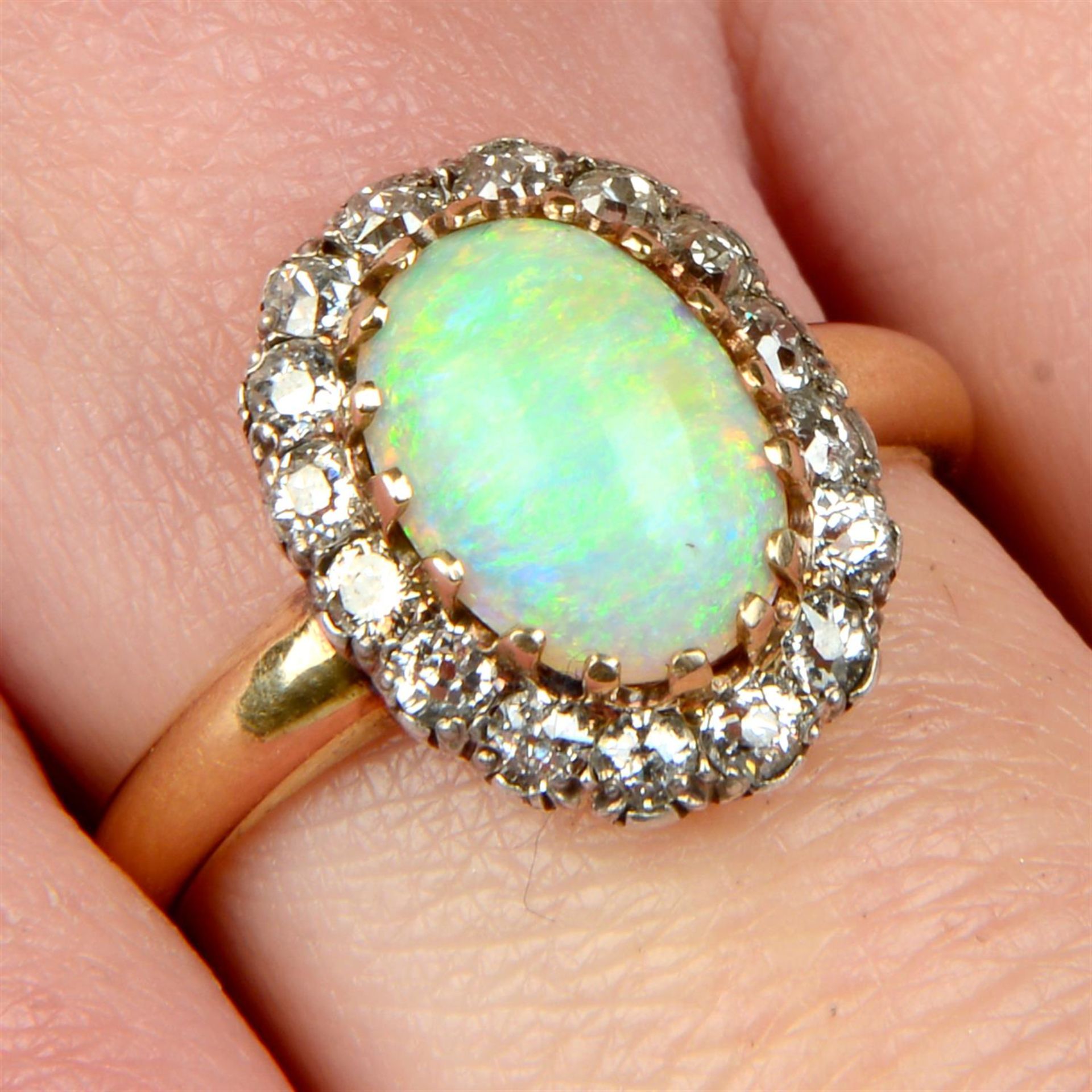 A late Victorian silver and 18ct gold opal and old-cut diamond cluster ring.