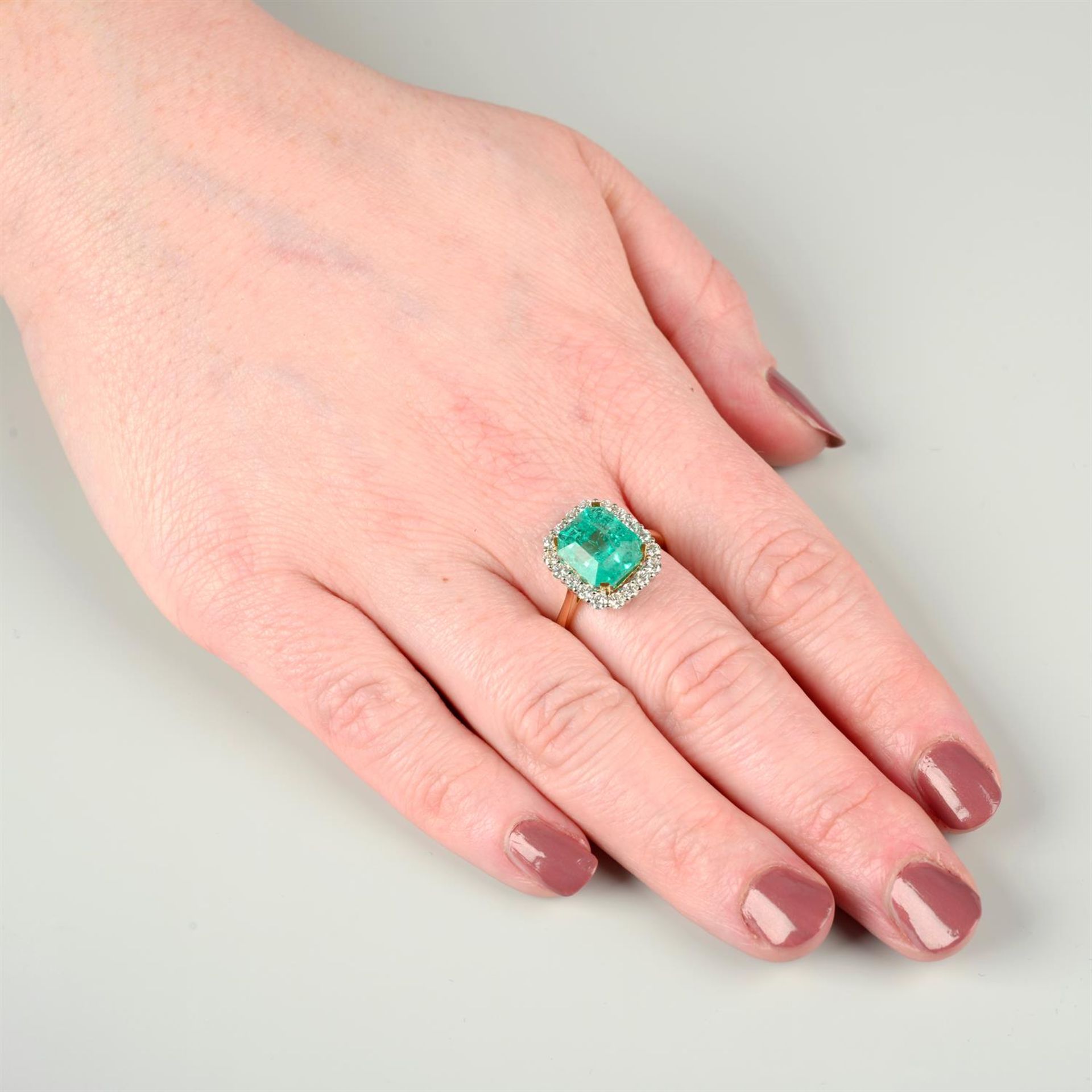 An 18ct gold Colombian emerald and brilliant-cut diamond cluster ring. - Image 5 of 6