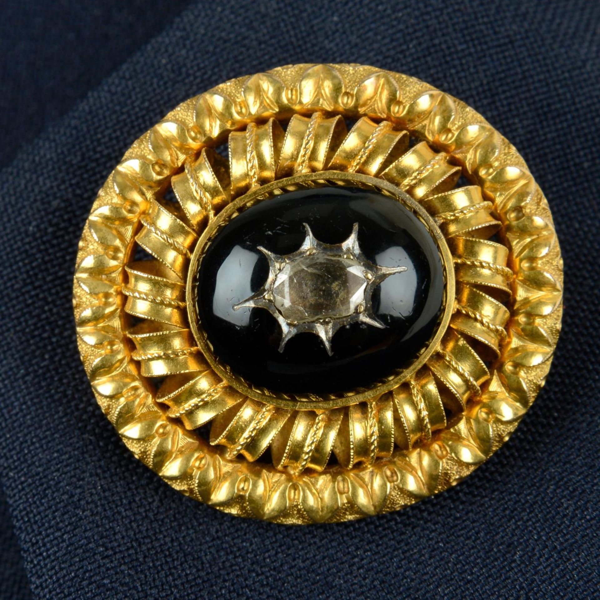 A mid Victorian gold rose-cut diamond and black enamel brooch.