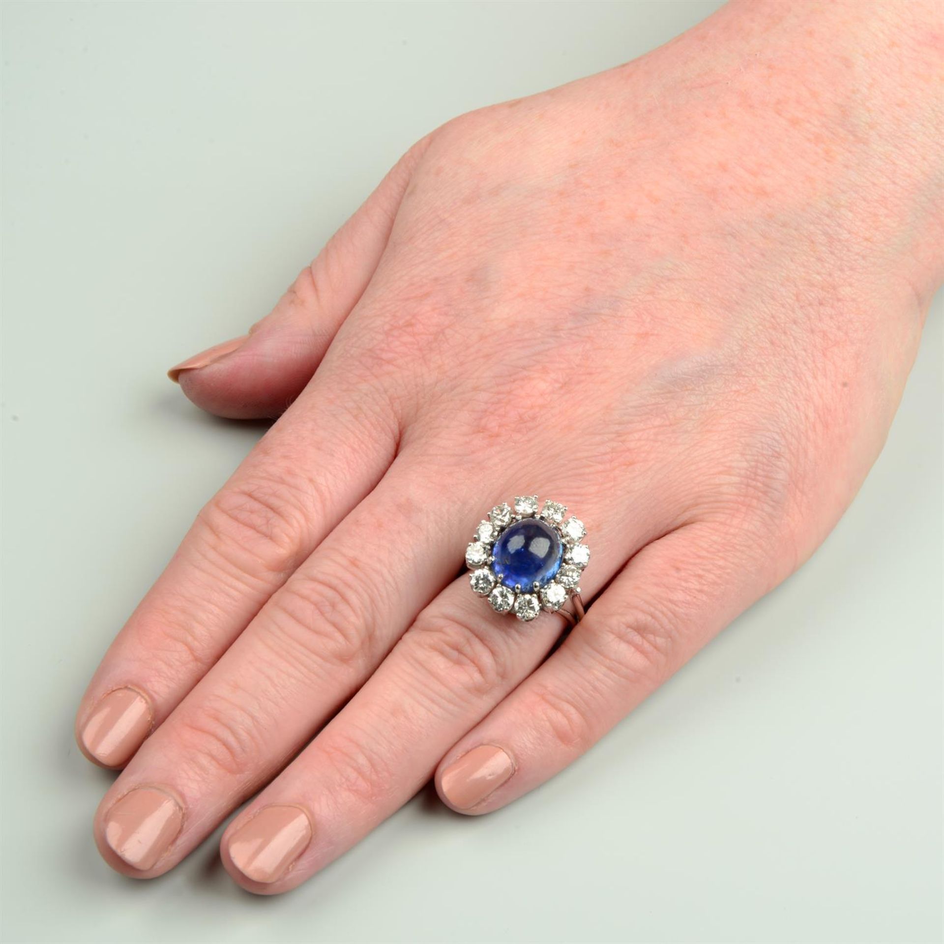 A mid 20th century gold Sri Lankan sapphire and brilliant-cut diamond cluster ring. - Image 5 of 5