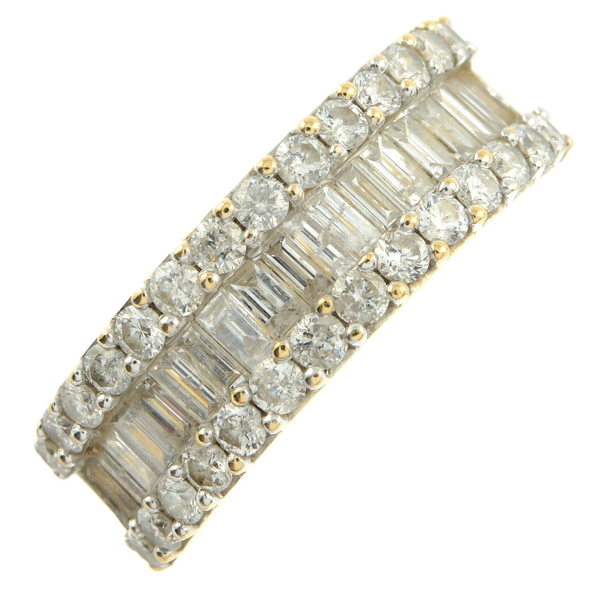 An 18ct gold baguette and brilliant-cut diamond three-row half eternity ring. - Bild 2 aus 5