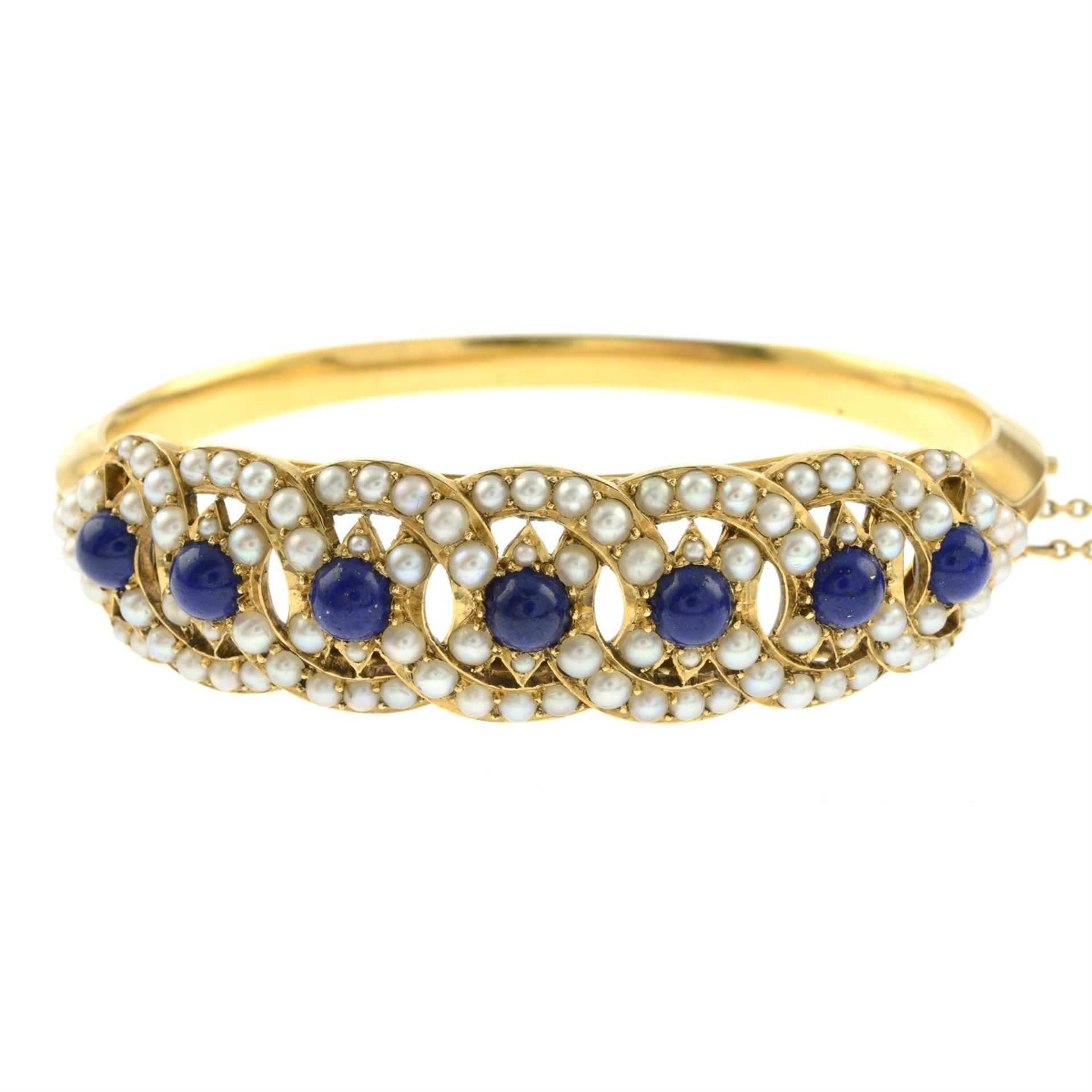 A Victorian gold lapis lazuli and split pearl hinged bangle. - Bild 2 aus 3