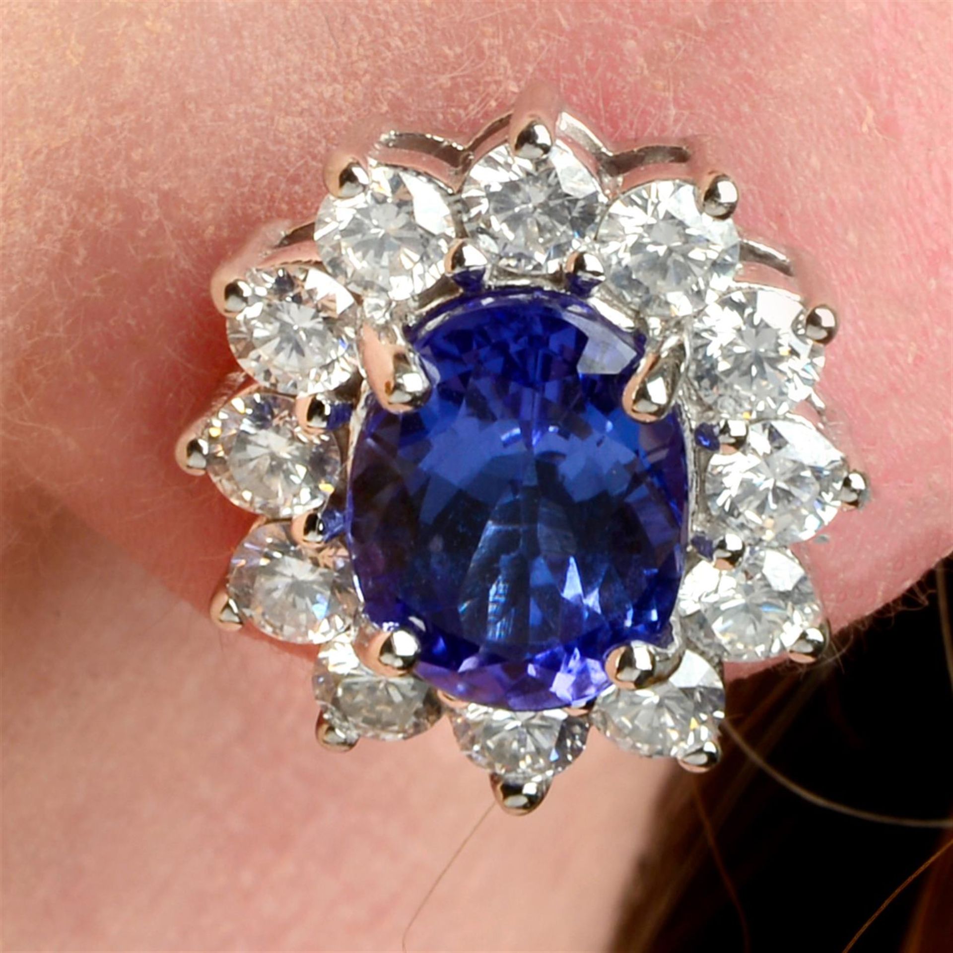 A pair of tanzanite and brilliant-cut diamond cluster earrings.