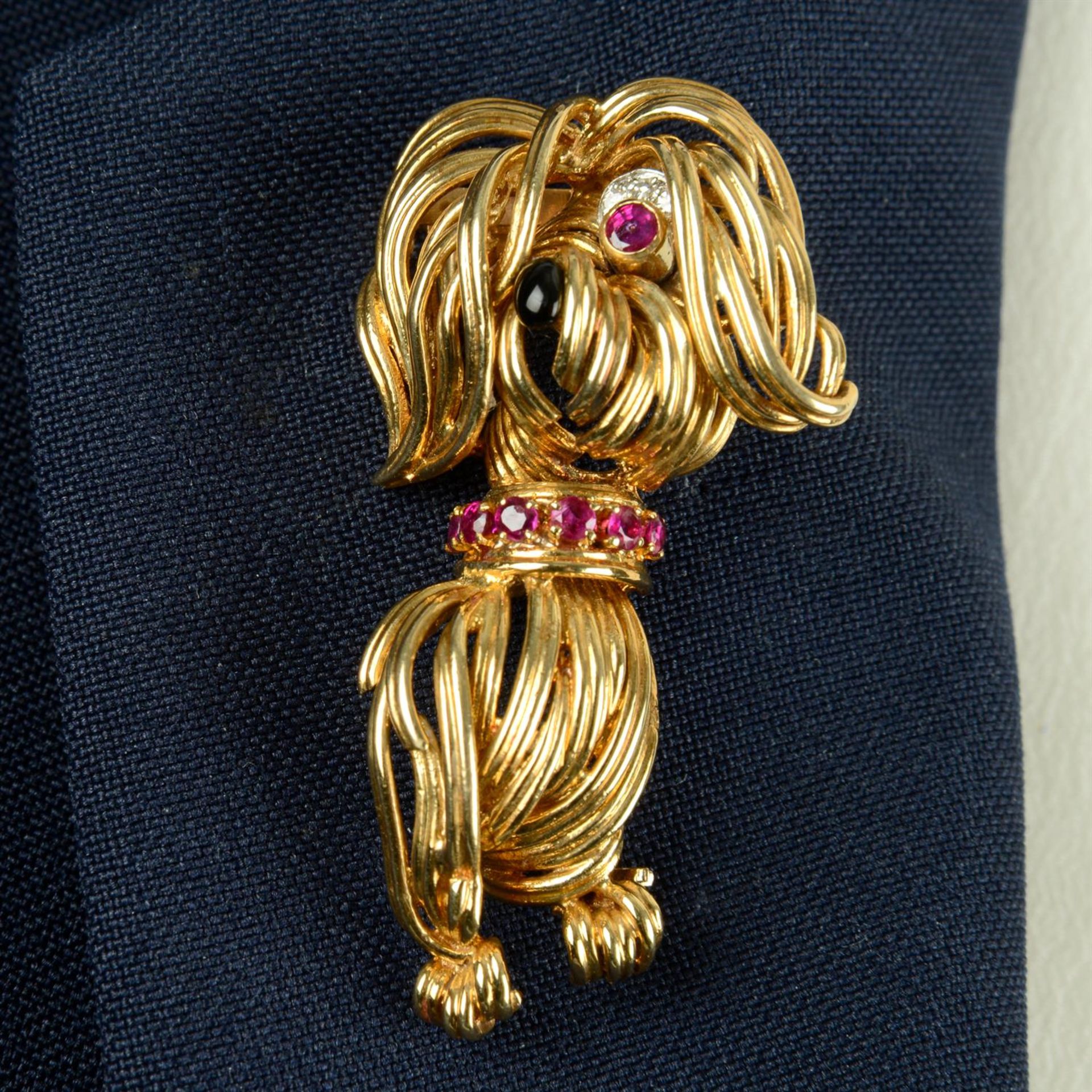 A mid 20th century 18ct gold diamond, ruby and onyx highlight dog brooch, by Van Cleef & Arpels.